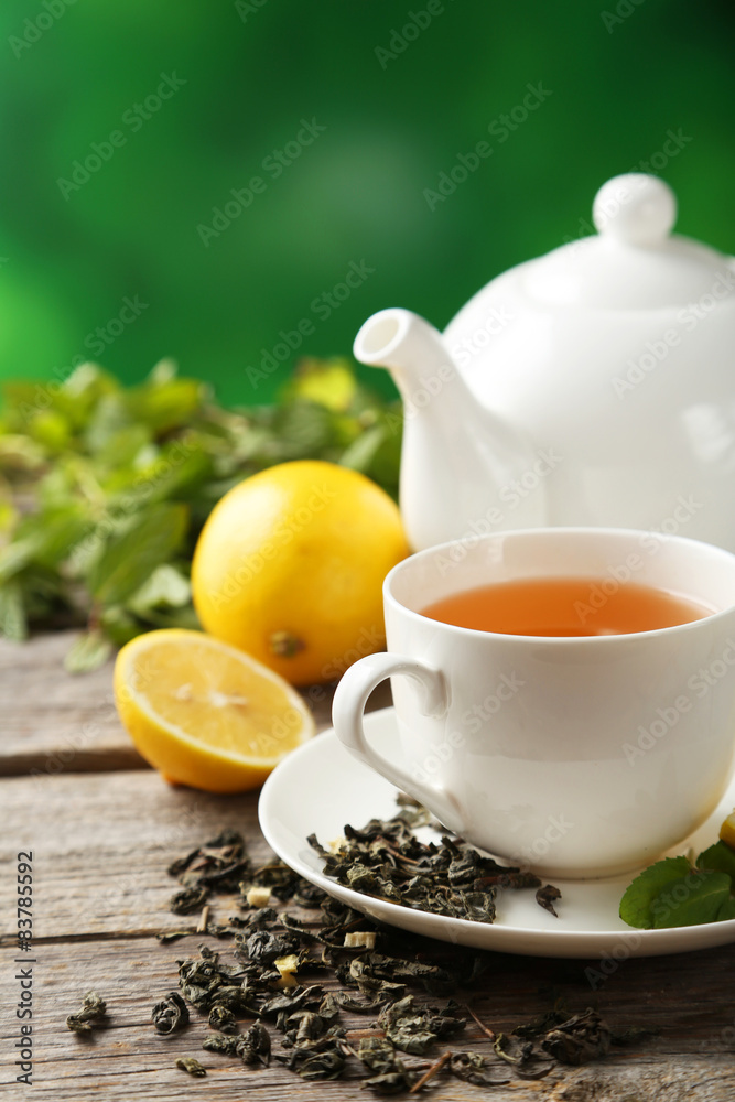 Green tea in cup and teapot 