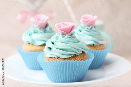 Tasty cupcake on pink background