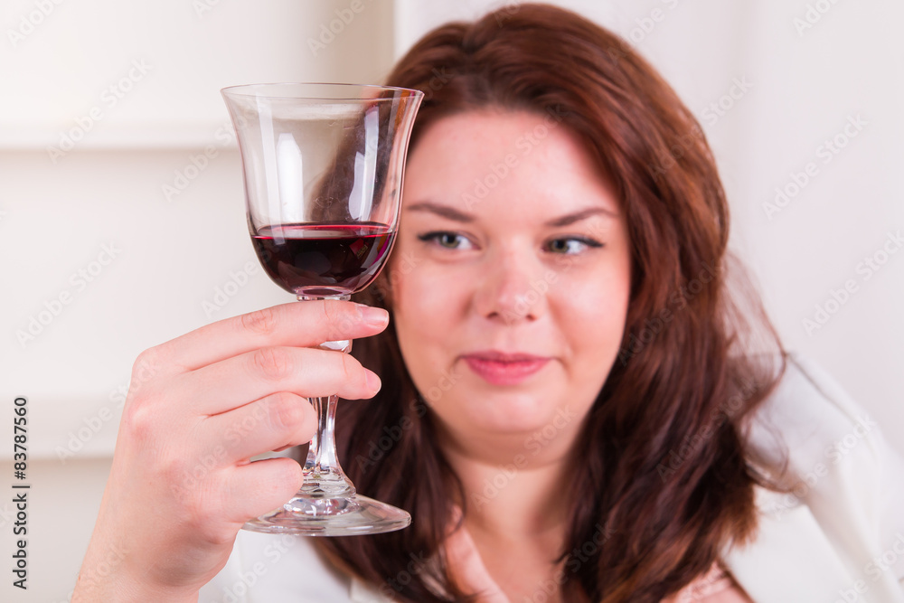 Cheerful woman holding a glass of wine Cheerful woman holding a glass of wine