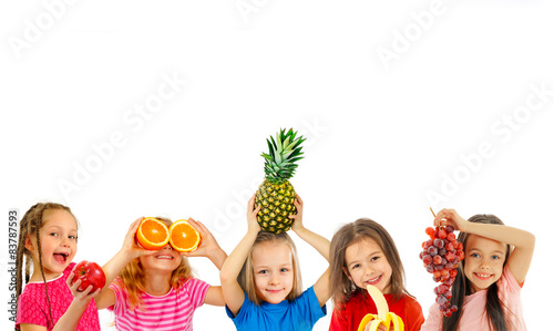 Happy children with fruits
