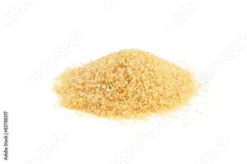 Brown sugar in spoon and bowl on wooden background
