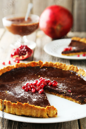 Homemade chocolate tart with pomegranate 