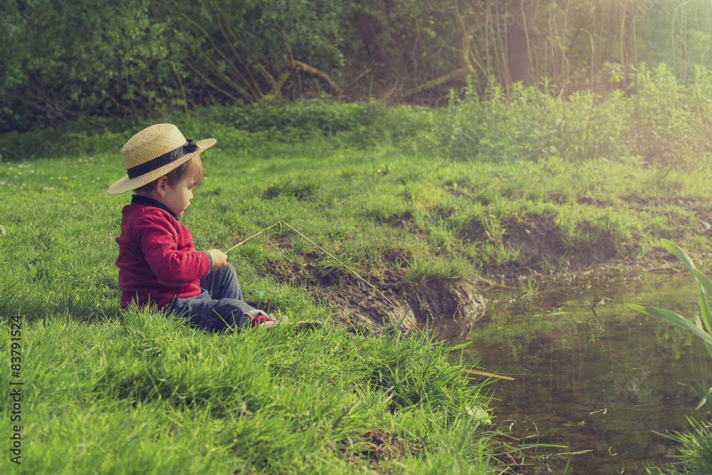 cute child playing by the water cute child playing by the water