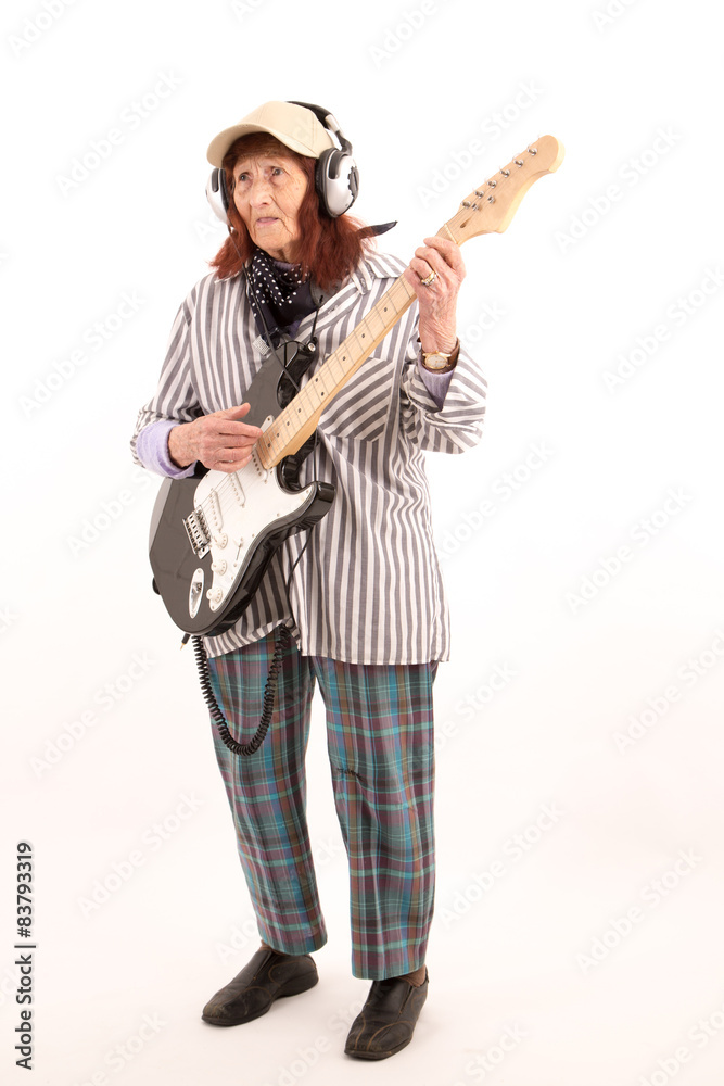 Funny elderly lady playing electric guitar. Funny elderly lady playing electric guitar.