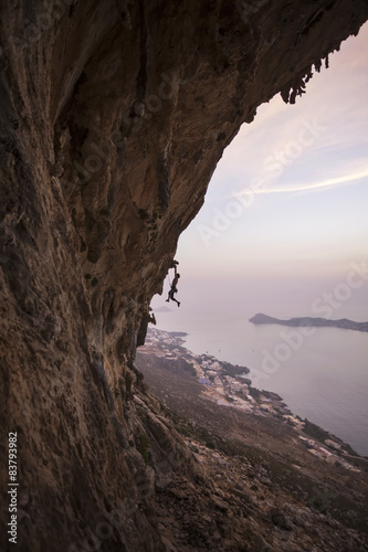 Rock climber on a cliff, Kalymnos Island, Greece