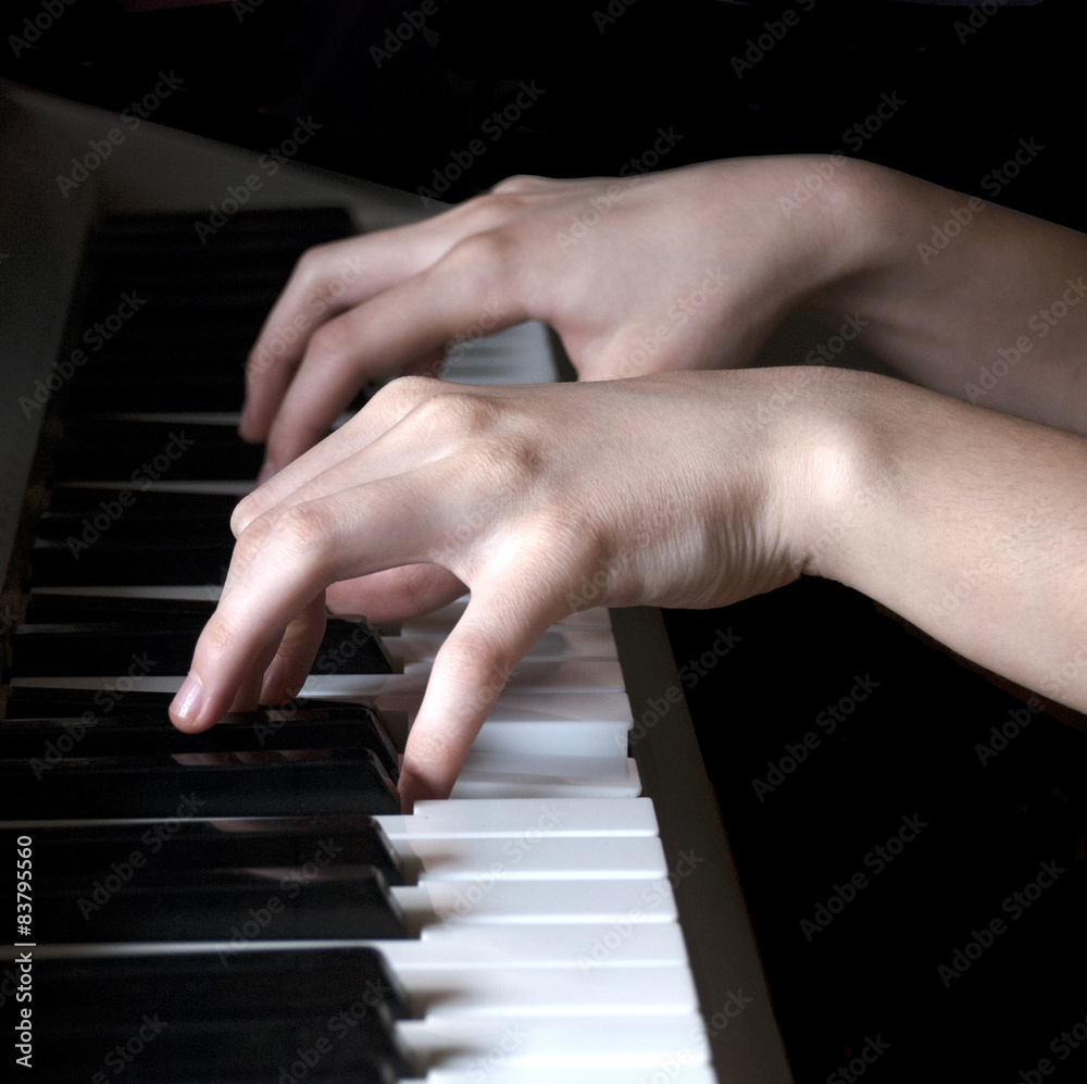 Fototapeta premium Hands of teenager playing synthesizer