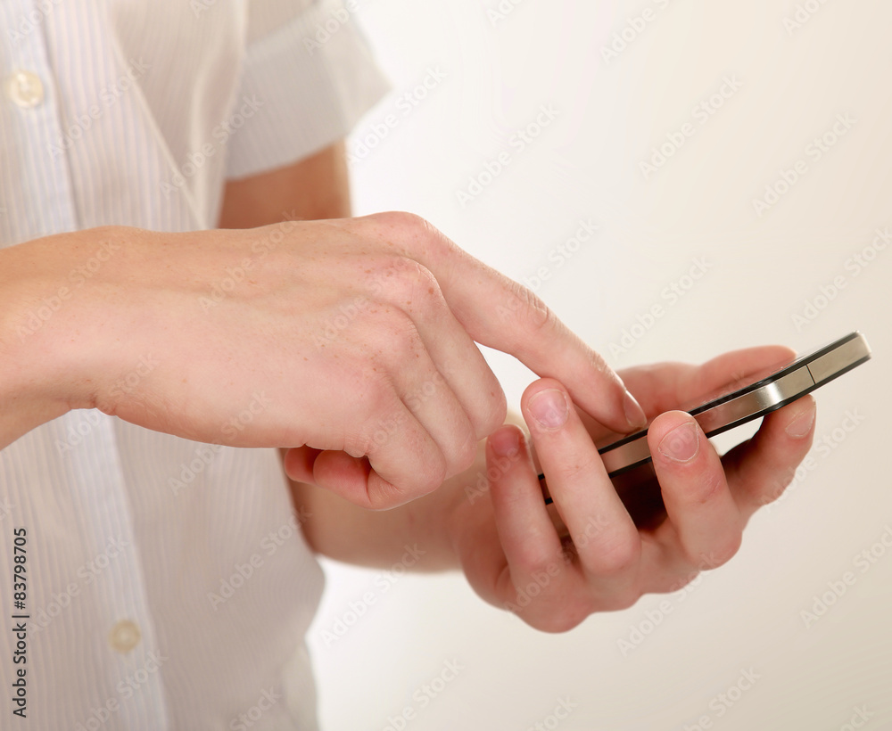 Mobile phone on hand, isolated on white background Mobile phone on hand, isolated on white background