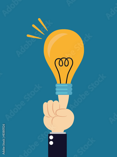  Light bulb lit from human hand on blue background