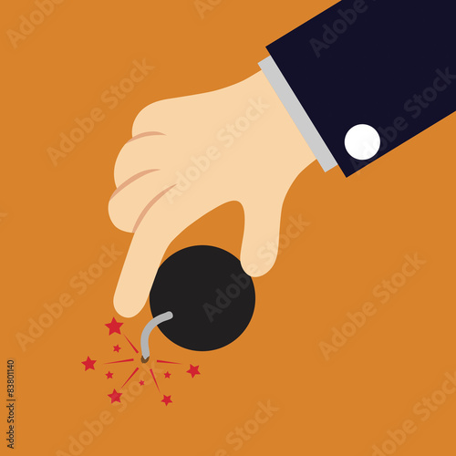 Hand holds bomb on orange background