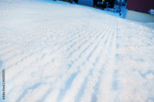 Shiny snow with tracks, outdoors