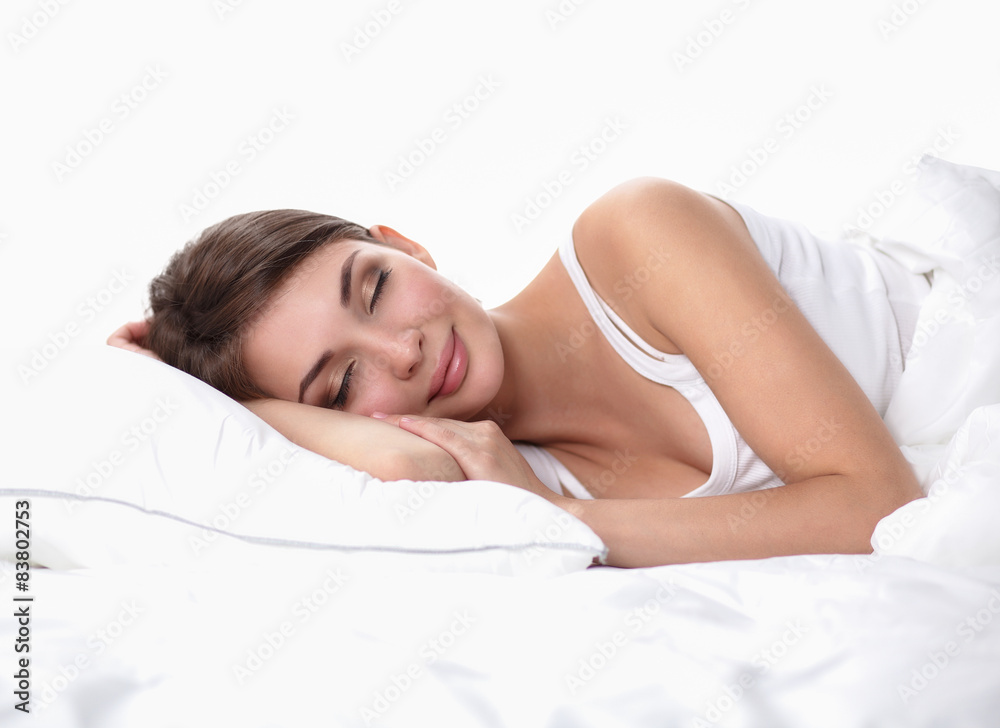 Beautiful girl sleeps in the bedroom, lying on bed Beautiful girl sleeps in the bedroom, lying on bed