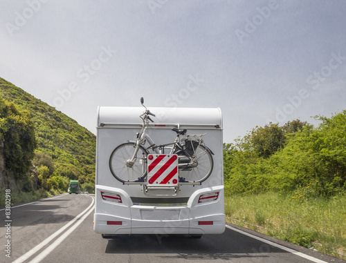 car caravan bike moving on the road