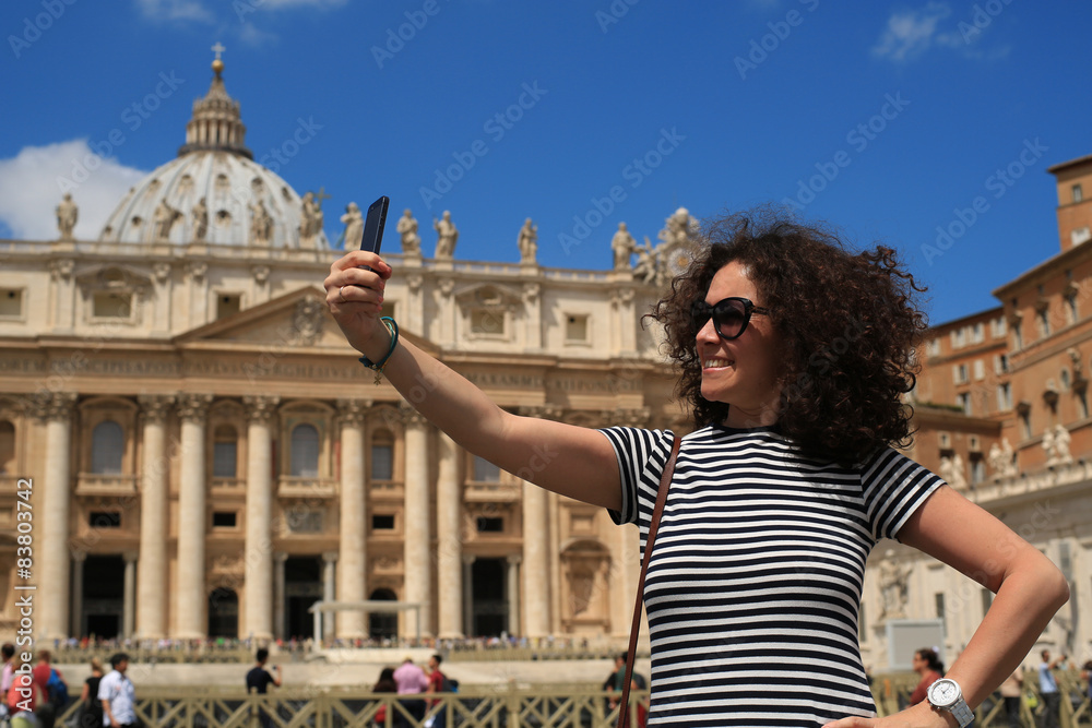 Beautiful young woman on the background of the Vatican