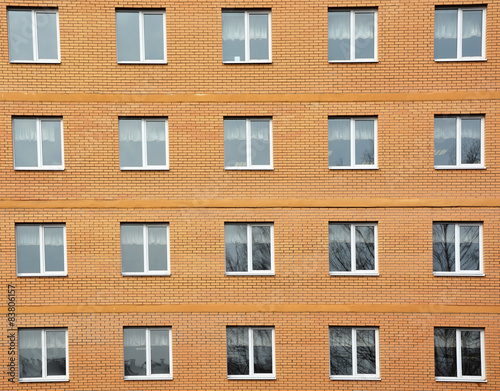 Architectural background- windows and home wall from yellow brick