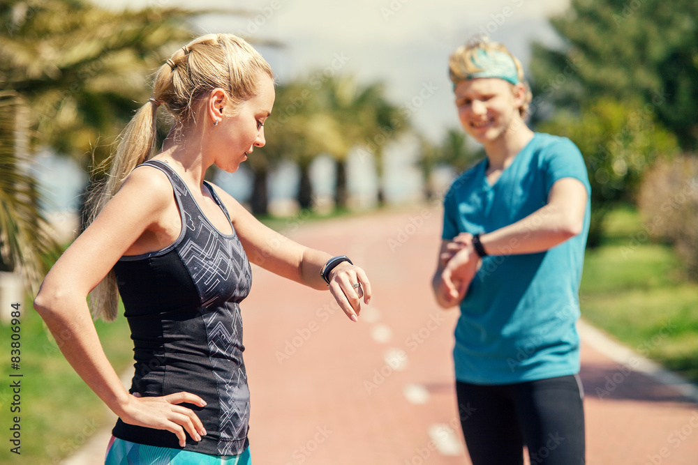 Two runners checked results of run distance