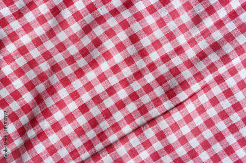 Red picnic tablecloth background. Red and white fabric texture.