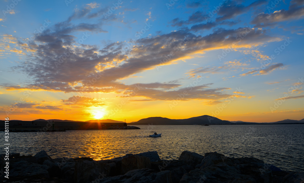 colorful sky over Alghero harbor at sunset
