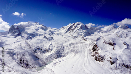 snow alps mountains view and blue sky
