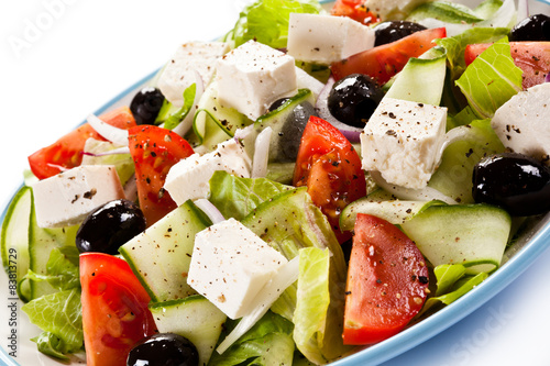 Greek salad on white background