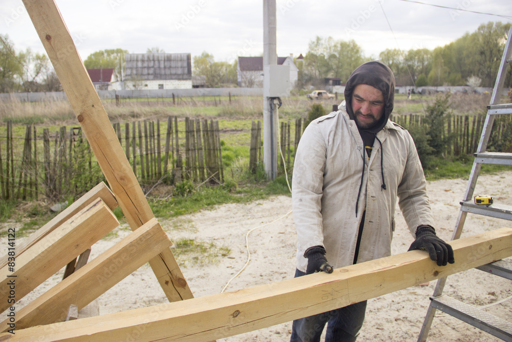 a man with a beard, a builder, working with wood, wood grinder g a man with a beard, a builder, working with wood, wood grinder g