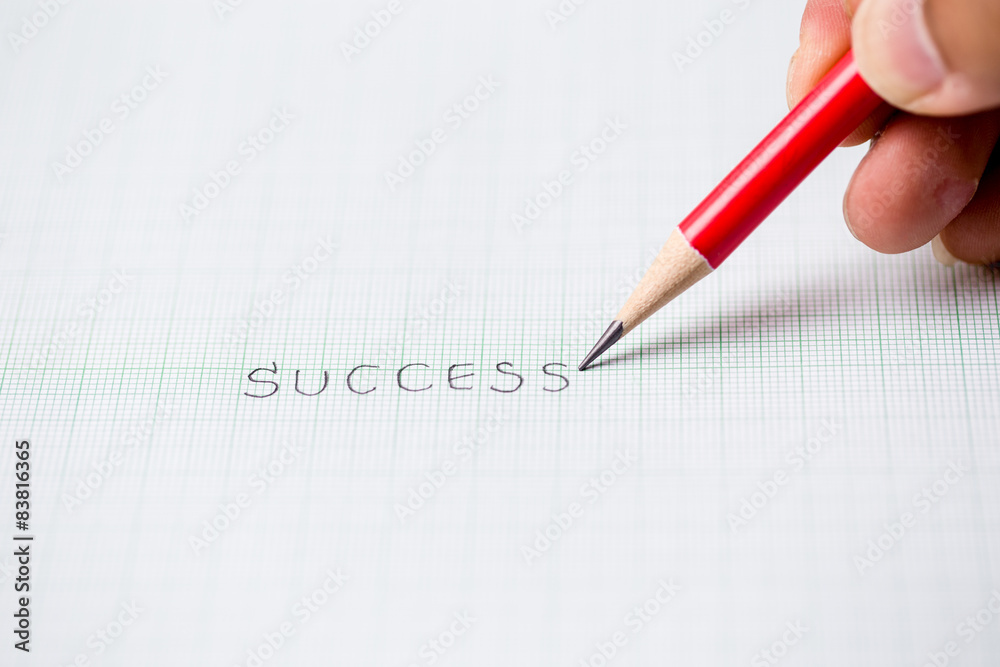 Success sketch text written red pencil graph paper background Success sketch text written red pencil graph paper background