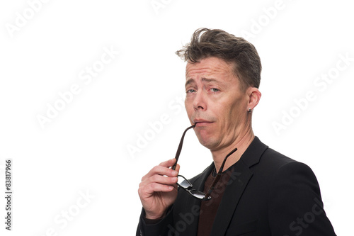 Businessman Showing Dismissive Shrug Against White photo