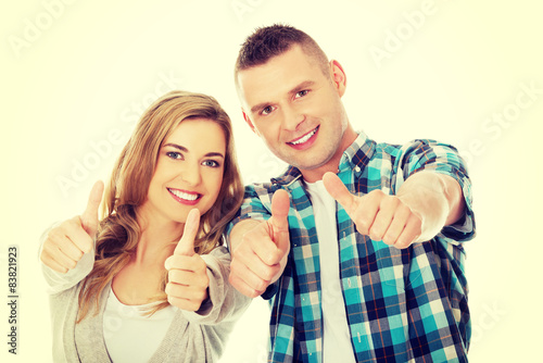 Couple showing thumbs up