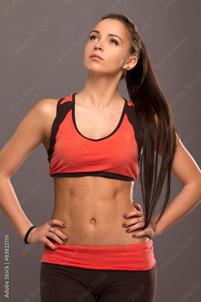 Beautiful dark-haired girl is engaged in sports and posing in the studio . lifestyle Beautiful dark-haired girl is engaged in sports and posing in the studio . lifestyle