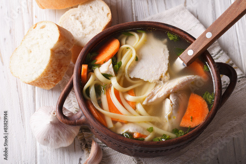 Homemade chicken soup with noodles. Horizontal top view 