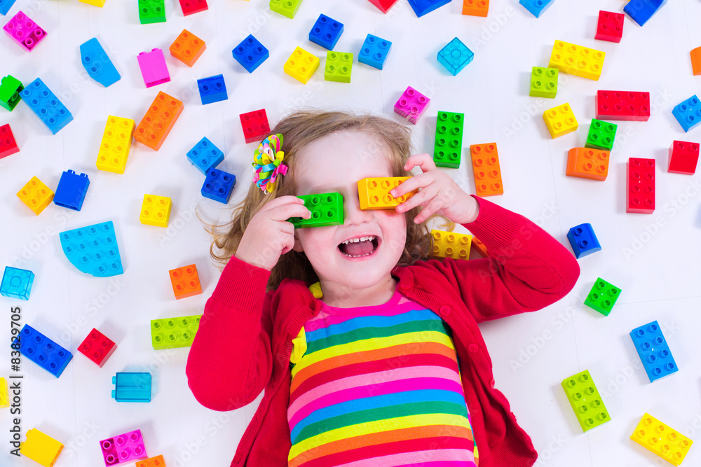 Little girl playing with colorful blocks Little girl playing with colorful blocks