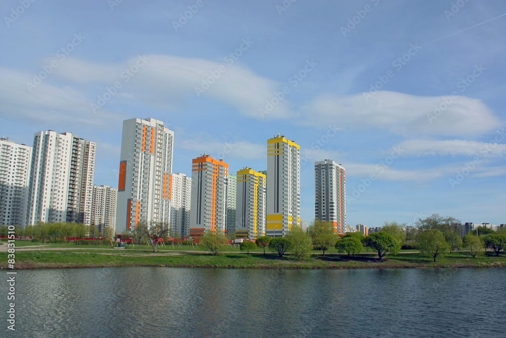 multi-storey houses on the lake in the park