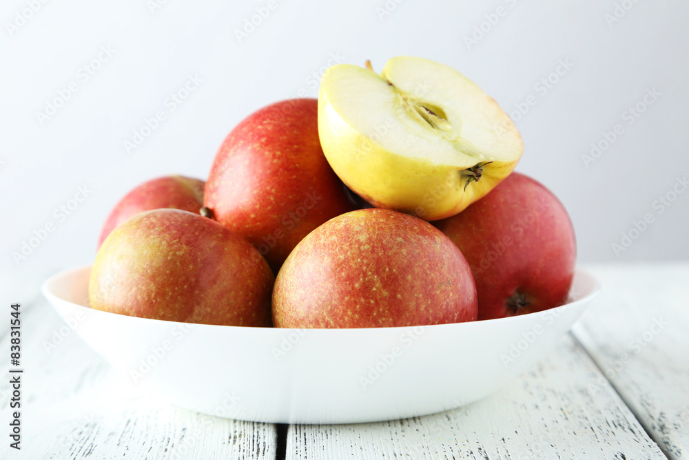 Apples in bowl on white wooden background Apples in bowl on white wooden background