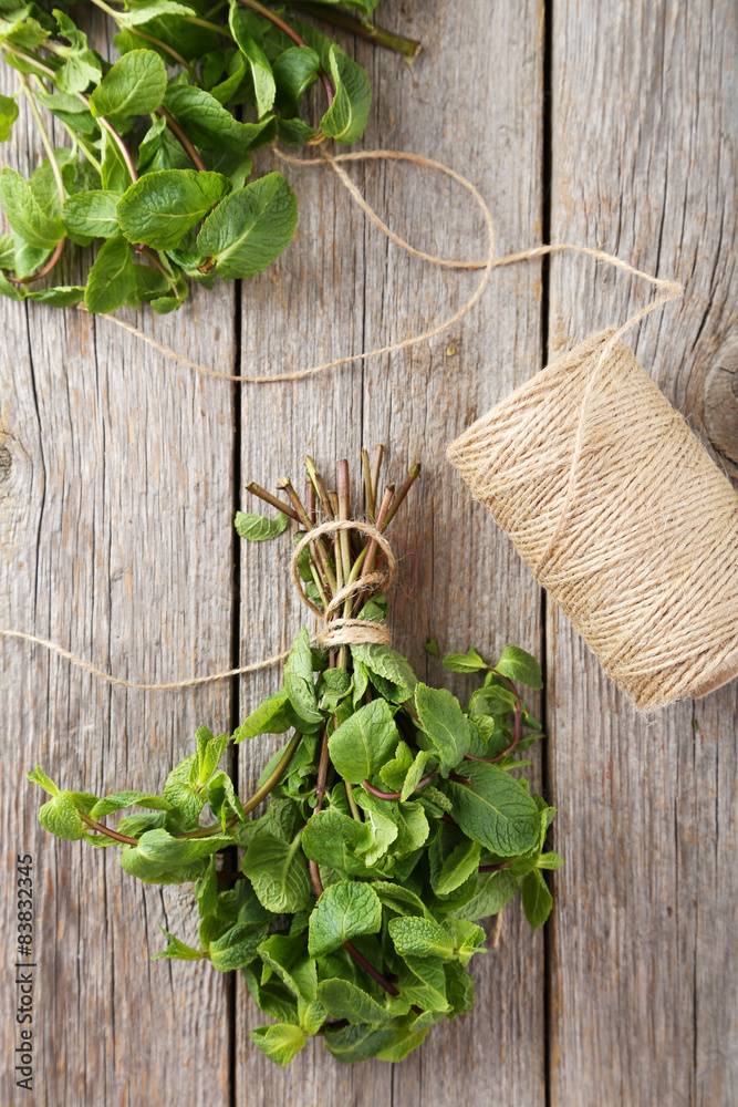 Fresh mint on grey wooden background Fresh mint on grey wooden background