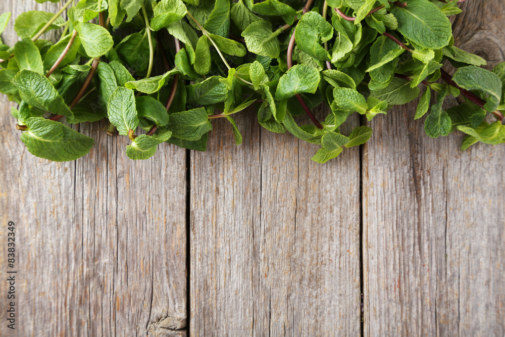 Fresh mint on grey wooden background Fresh mint on grey wooden background