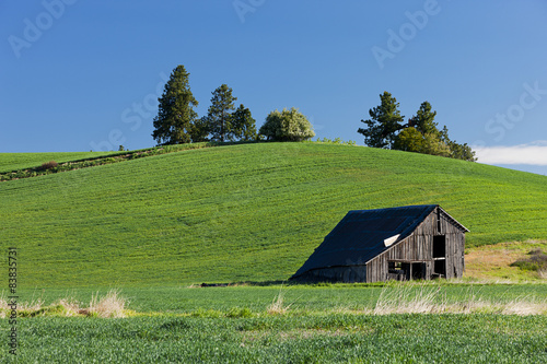 Old barn by hill. photo