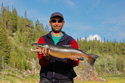Fisherman caught a nice male salmon in the north river.