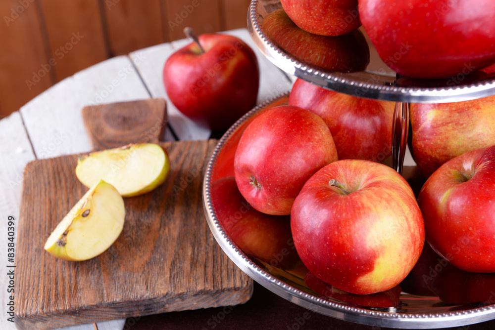 Tasty ripe apples on serving tray on table close up Tasty ripe apples on serving tray on table close up