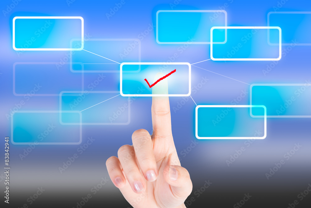 Hand pressing tick symbol button with technology background Hand pressing tick symbol button with technology background