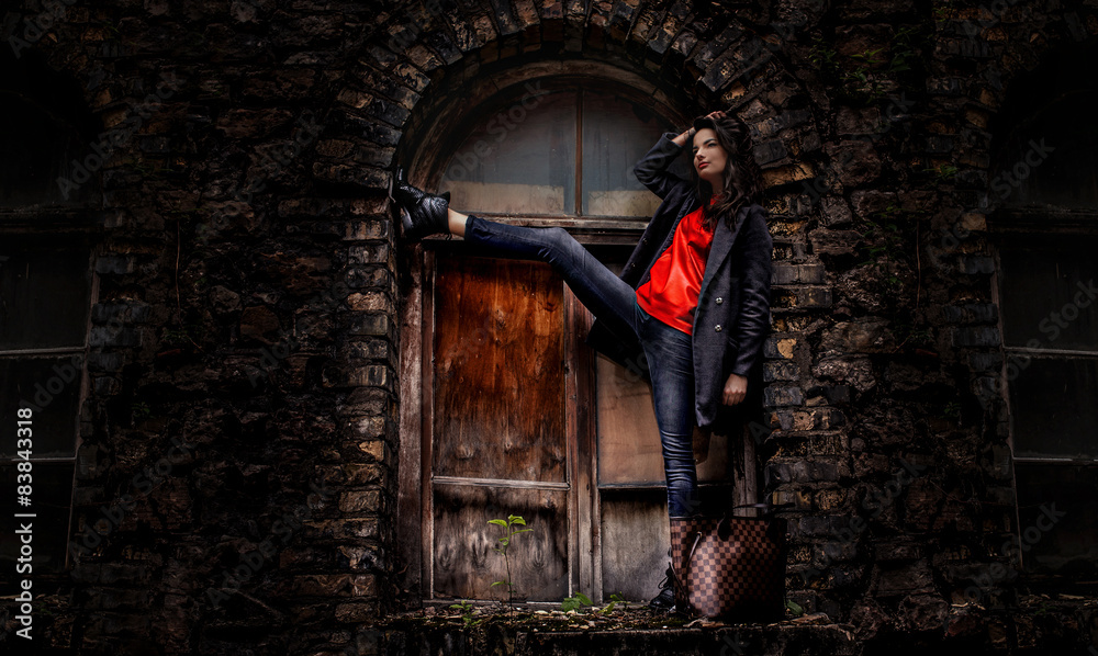 Casula girl posing over old window