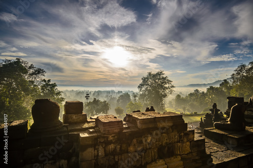 Sunrise over the ancient temple lost in the jungle. Borobudur.