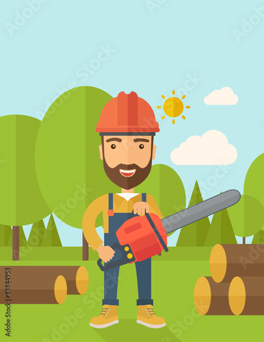Lumberjack cuts a tree by chainsaw