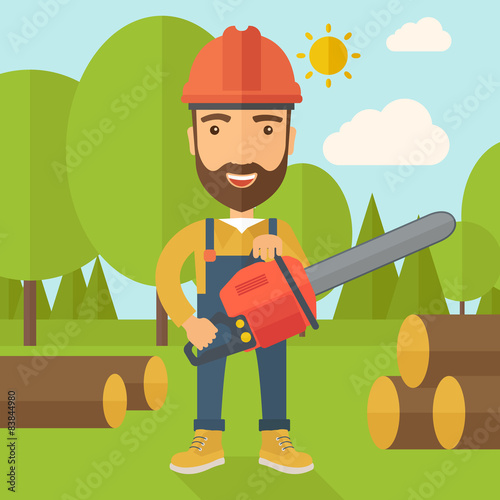 Lumberjack cuts a tree by chainsaw