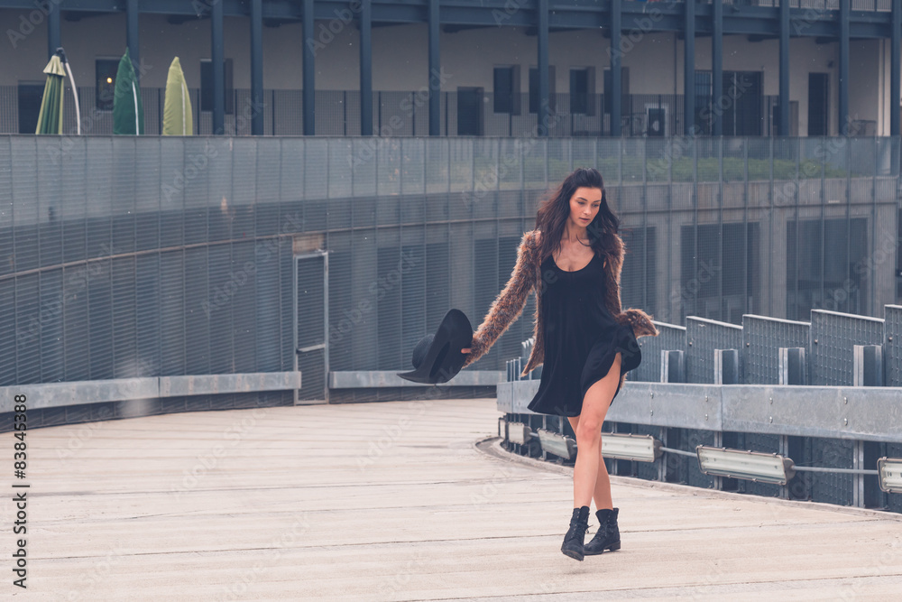 Beautiful girl posing in an urban context Beautiful girl posing in an urban context