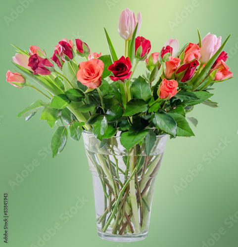 Fototapeta Naklejka Na Ścianę i Meble -  Red Roses flowers with pink tulips, transparent vase.