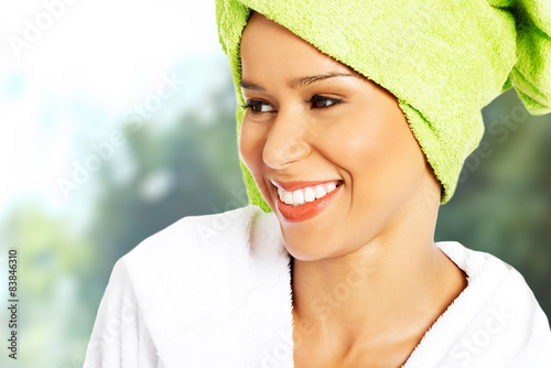 Spa woman in bathrobe and turban.