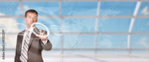 Businessman pressing on holographic screen