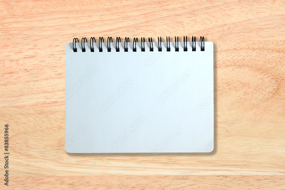 white page of notebook on wood texture white page of notebook on wood texture
