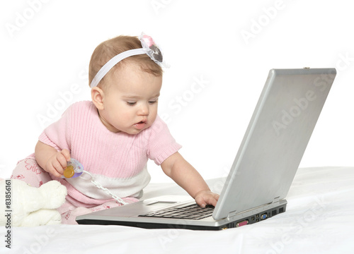 baby playing with laptop 