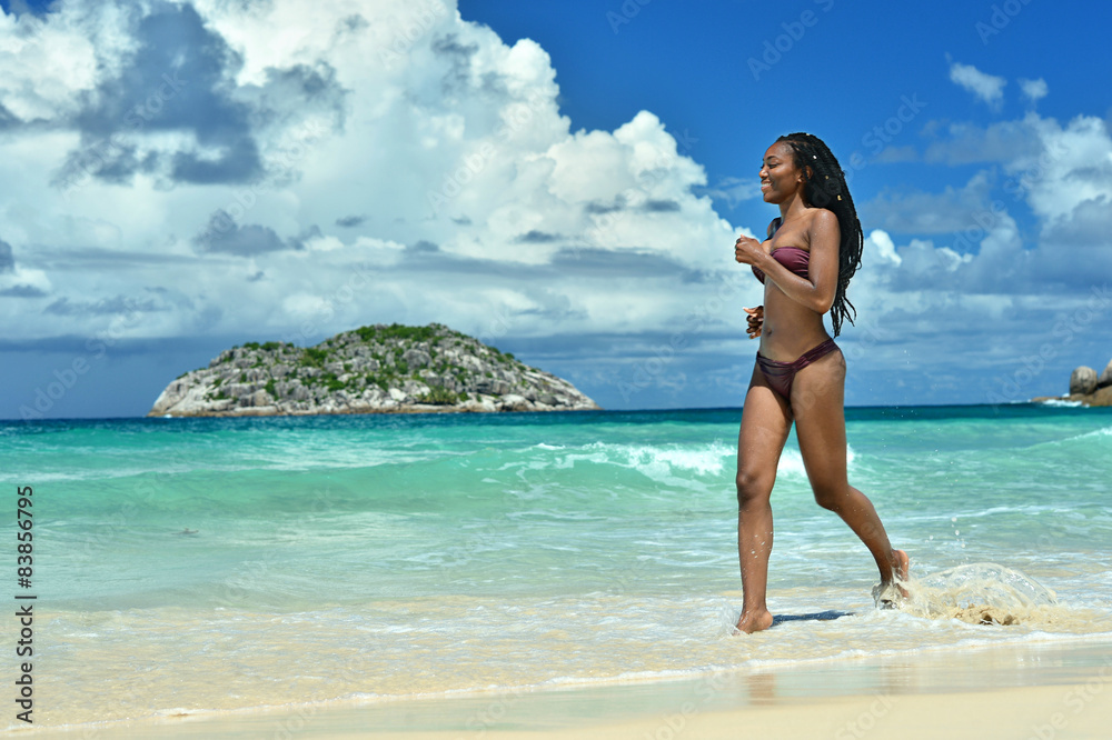  woman running along the beach
