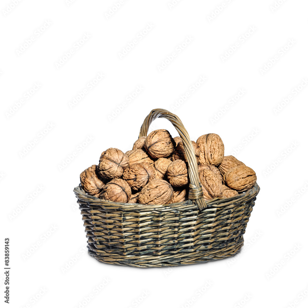 Basket full of walnuts, isolated on white Basket full of walnuts, isolated on white